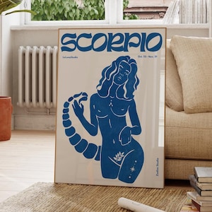May include: A blue and beige zodiac poster featuring the Scorpio sign. The poster showcases a stylized illustration of a woman with a scorpion tail, set against a light beige background.  The text 'Scorpio' is prominently displayed in a bold, blue typeface.  Additional text includes 'Oct. 23 - Nov. 21', 'LunaStudio', and 'Zoltar Studio'. The overall style is reminiscent of vintage linocut prints.