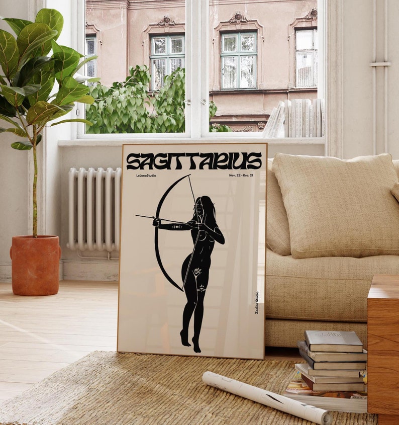 May include: Black and white illustration of a woman with an arrow and bow, representing the zodiac sign Sagittarius. The text "SAGITTARIUS" is at the top of the poster, with the dates "Nov. 22 - Dec. 21" below it.