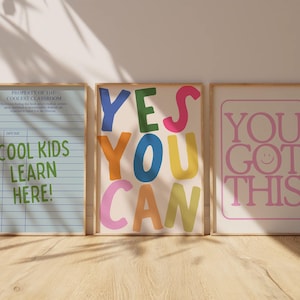 May include: Three framed art prints with positive messages. One print reads "Cool Kids Learn Here!" in green. Another says "Yes You Can" in colorful letters. The third print says "You Got This" in pink.