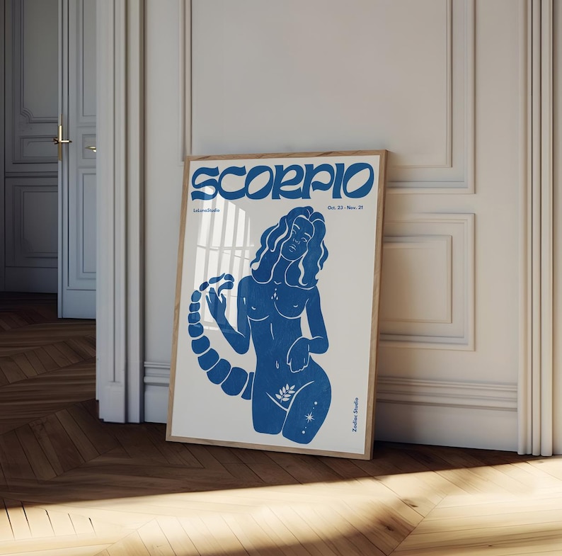 Pode incluir: Um cartaz azul e branco com a palavra "Scorpio" em letras azuis em negrito. O cartaz apresenta uma ilustra&ccedil;&atilde;o azul de uma mulher com cauda de escorpi&atilde;o, com as datas "Oct. 23 - Nov. 21" impressas abaixo do t&iacute;tulo.