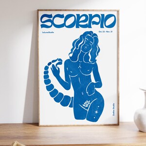 Pode incluir: Ilustra&ccedil;&atilde;o em silhueta azul do signo do zod&iacute;aco Escorpi&atilde;o, uma mulher com cauda de escorpi&atilde;o, sobre um fundo branco. O texto "Scorpio" est&aacute; em azul na parte superior da imagem, com as datas "Oct. 23 - Nov. 21" abaixo. O texto "LeLunaStudio" est&aacute; no canto inferior esquerdo e "Zodiac Studio" no canto inferior direito.