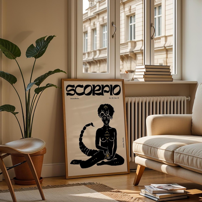 May include: A black and white poster with the word "Scorpio" in a stylized font. The poster features a black silhouette of a woman with a scorpion tail, sitting with her legs crossed. The poster has a cream background.