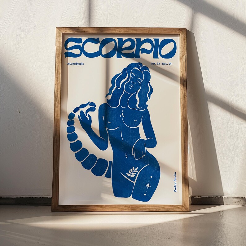 Pode incluir: Ilustra&ccedil;&atilde;o azul e branca de um signo do zod&iacute;aco Escorpi&atilde;o com o texto "Scorpio" em uma fonte em negrito e estilizada. O texto "Oct. 23 - Nov. 21" e "Zodiac Studio" tamb&eacute;m est&atilde;o inclu&iacute;dos.