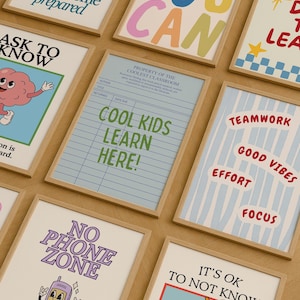 May include: A collection of framed posters with motivational phrases and cartoon illustrations. The posters feature phrases like "You Can", "Cool Kids Learn Here", and "No Phone Zone". The color palette includes blue, green, and red.