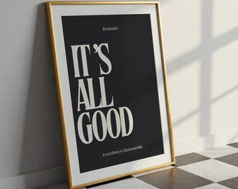 Op de afbeelding: Een ingelijste kunstdruk met een goudkleurige lijst. De print toont de woorden "IT'S ALL GOOD" in grote witte letters op een zwarte achtergrond. De woorden "Reminder" en "Everything is figureoutable" staan ook op het kunstwerk.