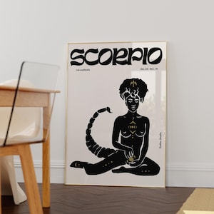 May include: Black and gold illustration of a Scorpio zodiac sign. The illustration features a woman with a scorpion tail sitting in a yoga pose. The text "Scorpio" is written in a bold, stylized font. The text "Oct. 23 - Nov. 21" is written below the zodiac sign.