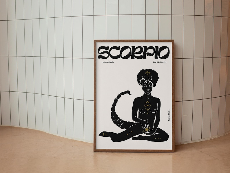 May include: A black and white illustration of a Scorpio zodiac sign. The illustration features a woman with a scorpion tail and gold accents. The text "Scorpio" is written in a bold, stylized font at the top of the image. The dates "Oct. 23 - Nov. 21" are written below the title.