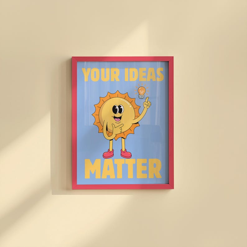May include: A framed poster with a cartoon sun character on a light blue background. The sun has a smiling face, pointing finger, and a lightbulb above its head. The words "YOUR IDEAS MATTER" are in yellow.