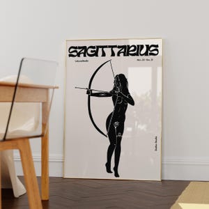 May include: Black and white illustration of a Sagittarius zodiac sign. The illustration features a woman holding a bow and arrow. The text "Sagittarius" is written in a bold, stylized font. The text "Nov. 22 - Dec. 21" is written below the zodiac sign.