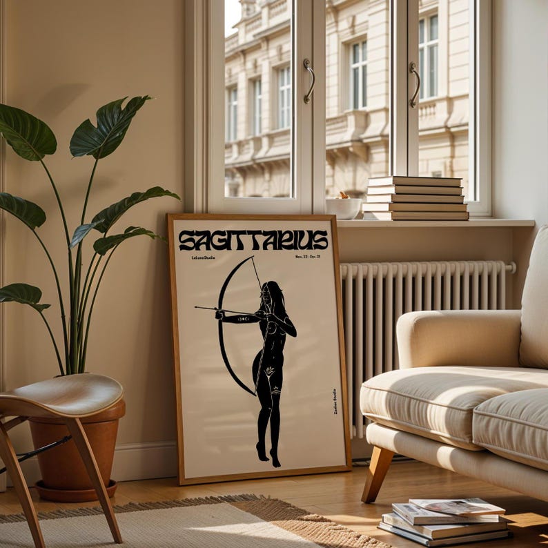 May include: A black and white poster with the word "Sagittarius" in a retro font. The poster features a silhouette of a woman holding a bow and arrow.