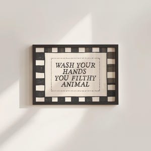 May include: A rustic wooden sign with the text "Welcome to our home" in white lettering. The sign features a distressed finish and a simple, inviting design, perfect for entryway decor.