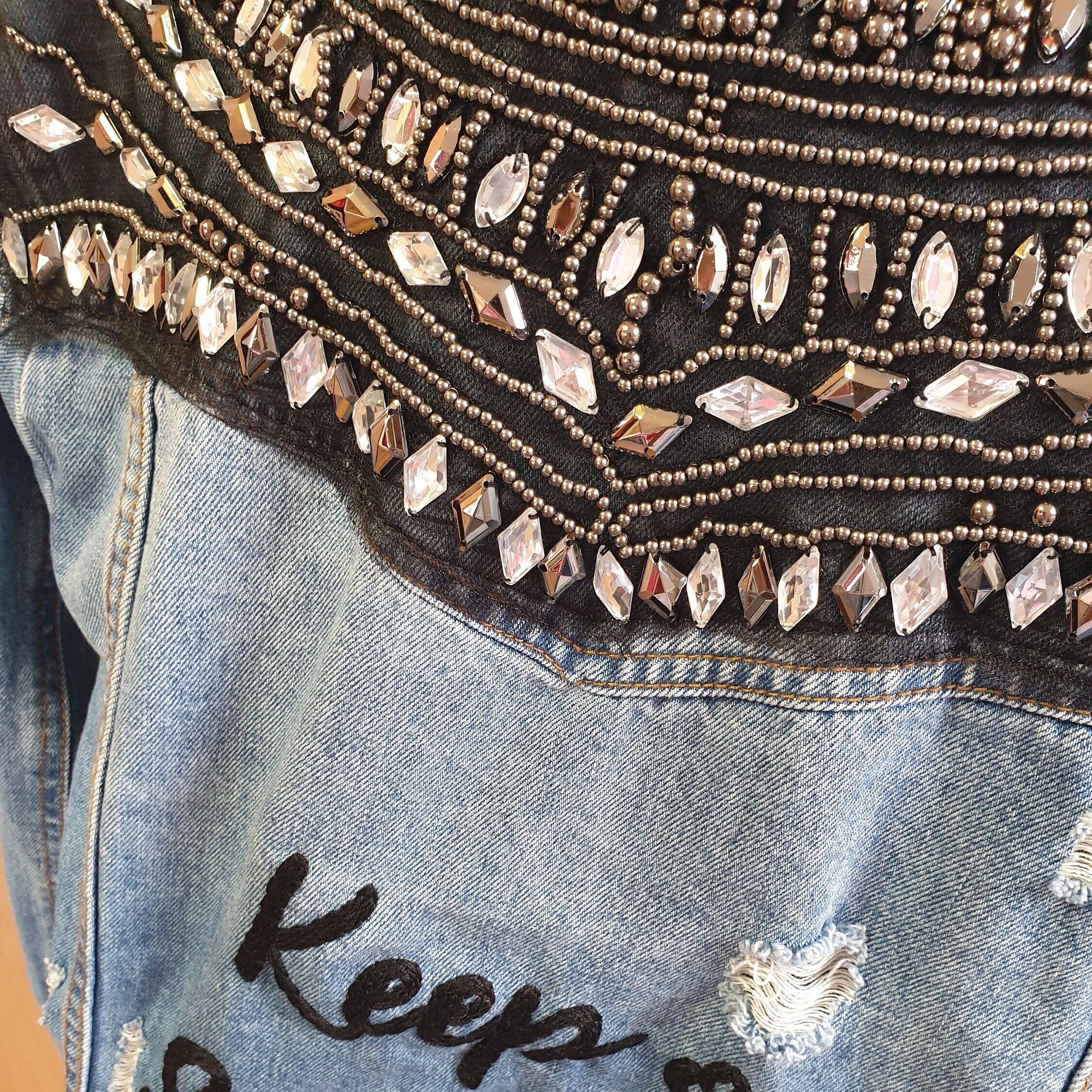Rivet embellished embroidered denim jacket