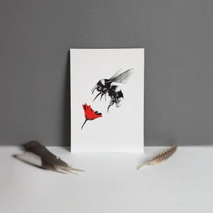 May include: A set of three ceramic nesting bowls in shades of blue, green, and white. The bowls feature a speckled glaze and a simple, modern design. The largest bowl measures approximately 6 inches in diameter.