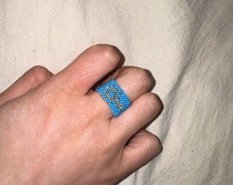 turquoise beaded ring with golden kazakh traditional fem ornament