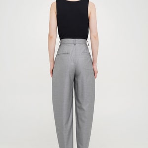 Wool women trousers with pockets, belt loops, pleats and baggy fit