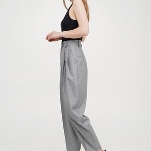 Silver women baggy trousers from wool fabric with pleats, pockets, zipper and button closure