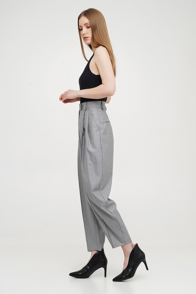 Silver women baggy trousers from wool fabric with pleats, pockets, zipper and button closure