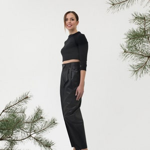 A women dressed in baggy pants from soft black cotton fabric