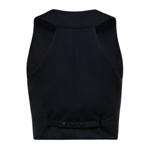 Back side of black cropped vest with button fastening on half-waist