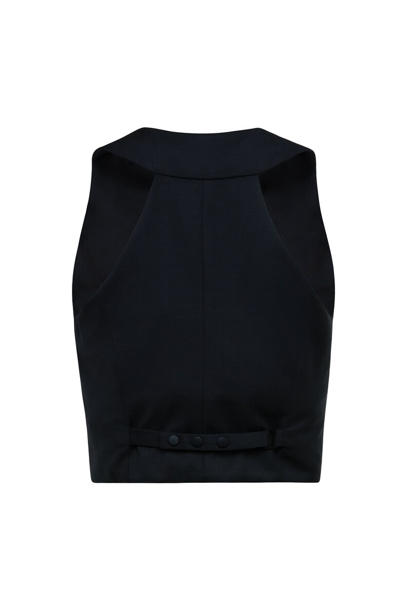 Back side of black cropped vest with button fastening on half-waist