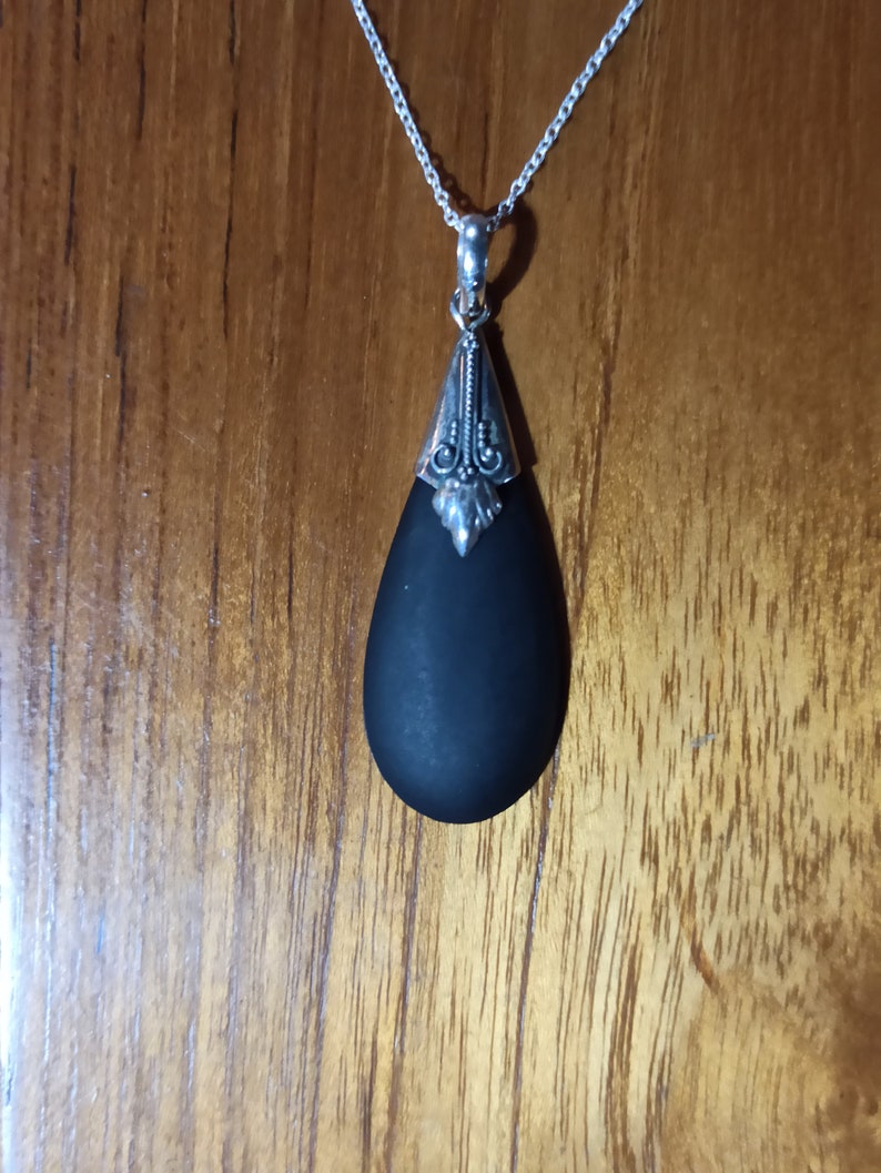 Silver pendant and lava stone
