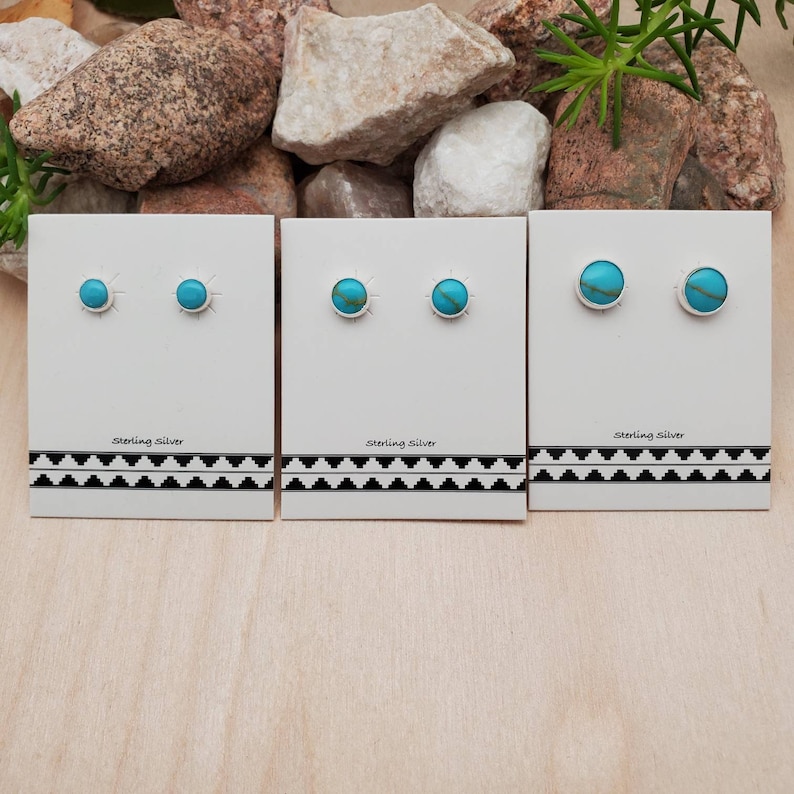 May include: Three sets of sterling silver earrings with turquoise stones. Each set has two earrings.