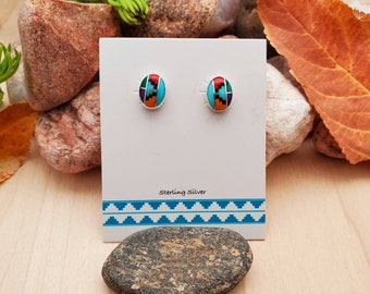 May include: A pair of sterling silver earrings with a colourful inlay design. The earrings are displayed on a white card with the text "Sterling Silver".