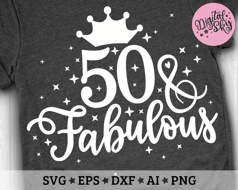 May include: A white graphic design on a dark gray t-shirt with a crown, the number 50, an ampersand, and the word "fabulous". The design is surrounded by small white stars.