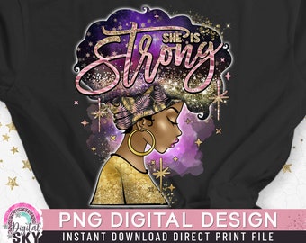 May include: A digital design featuring a woman with a purple and gold afro, wearing a pink and gold head wrap. The text "She is Strong" is written in pink and gold letters on the afro. The background is a purple and gold galaxy.