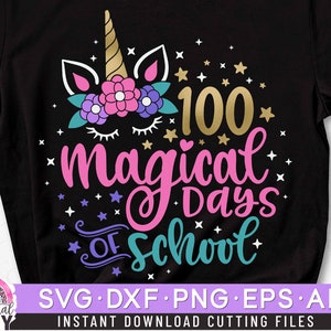 May include: A black t-shirt with a unicorn design and the text "100 magical days of school". The unicorn has a pink, purple, and white flower crown. The text is in pink, teal, and gold.