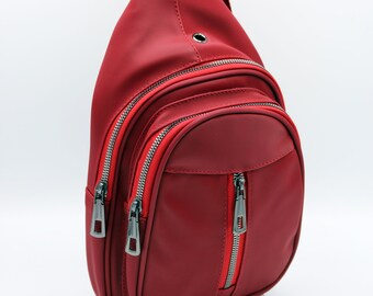 red sling backpack