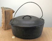 Unmarked LODGE 8 Dutch Oven w lid AND trivet