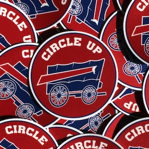 May include: A pile of red and blue round stickers with the text "Circle Up" and a graphic of a wagon with wheels.