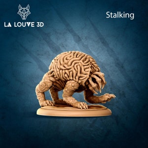 May include: A brown, brain-shaped creature with multiple eyes and sharp teeth, standing on a round base. The creature is in a stalking pose, with its head lowered and its eyes focused on something in the distance. The creature is a 3D printed miniature.