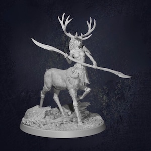 May include: A grey figurine depicting a centaur-like figure with a deer's body and a human upper body. The figure holds a long, spear-like weapon and is adorned with antlers and a crown. The figurine is mounted on a circular base.