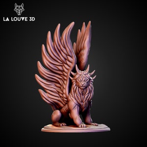 May include: A detailed, 3D printed miniature of a winged lion with a third eye and horns. The lion is sculpted in a seated position with its wings spread out behind it. The miniature is painted in a reddish-brown colour.