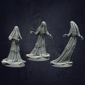 May include: Three grey painted figurines of a woman in a flowing gown. The figures are posed in different positions, with one facing forward, one facing to the side, and one facing backward. The figures are all wearing a long, flowing gown that appears to be made of fabric. The figures are all standing on a small base.