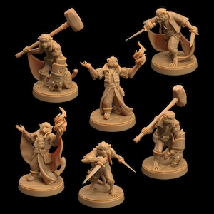 Op de afbeelding: Zes miniatuurfiguurtjes van aapachtige wezens, elk met een andere pose en wapen. De figuurtjes zijn in bruine kleur geverfd en staan op ronde bases.