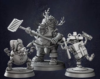 May include: Three gray fantasy figurines. The central figure is a large, muscular creature with antlers, holding a rake. To the left is a smaller, clown-like figure. On the right is a gift-shaped character with a hammer.