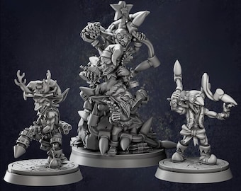 May include: Three detailed gray fantasy figurines. One figure holds a weapon, another has antlers and a gun, and the third is a tower of figures. All are on circular bases, set against a dark background.