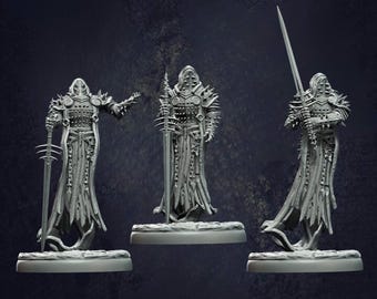 May include: Three grey painted miniature figures of warriors wearing cloaks and holding swords. The figures are posed in different stances and are standing on circular bases.