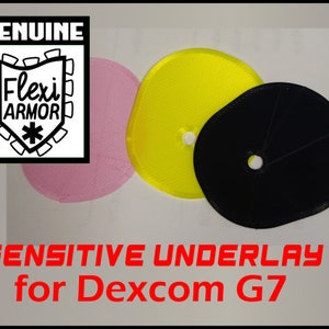 May include: Three round, adhesive underlays in pink, yellow, and black. The underlays are designed for the Dexcom G7 continuous glucose monitor. The text "SENSITIVE UNDERLAY for Dexcom G7" is printed in red below the underlays.