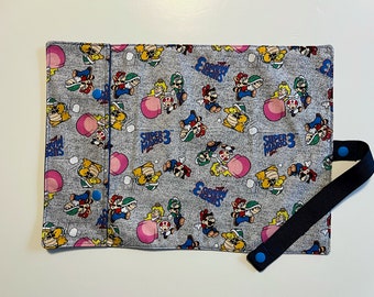 Mario Bros fabric placemat with utensil pocket, in blue or gray, for children