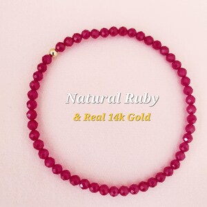 May include: A red ruby gemstone bracelet with a 14k gold bead. Natural Ruby & Real 14k Gold.