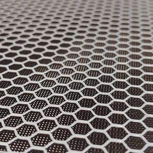 May include: A white honeycomb-shaped mesh pattern on a dark brown background.