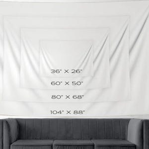 May include: White tapestry with four different size options listed in inches. The tapestry is hanging on a white wall above a gray couch.