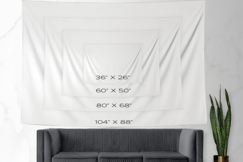 May include: White tapestry with four different size options listed in inches. The tapestry is hanging on a white wall above a gray couch.
