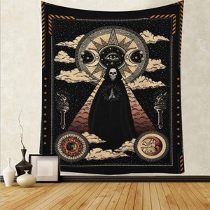 May include: A black tapestry featuring a dark figure in a hooded robe standing before a pyramid. The figure has a skull for a head and is holding its hands together in prayer. The tapestry incorporates a celestial design with stars, moons, and a sun with an eye at its centre.