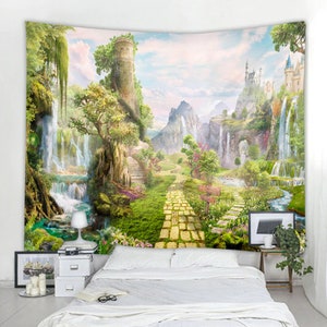 May include: A tapestry featuring a whimsical landscape with a yellow brick road leading to a castle in the distance. Lush greenery, waterfalls, and a stone tower are depicted in the scene.
