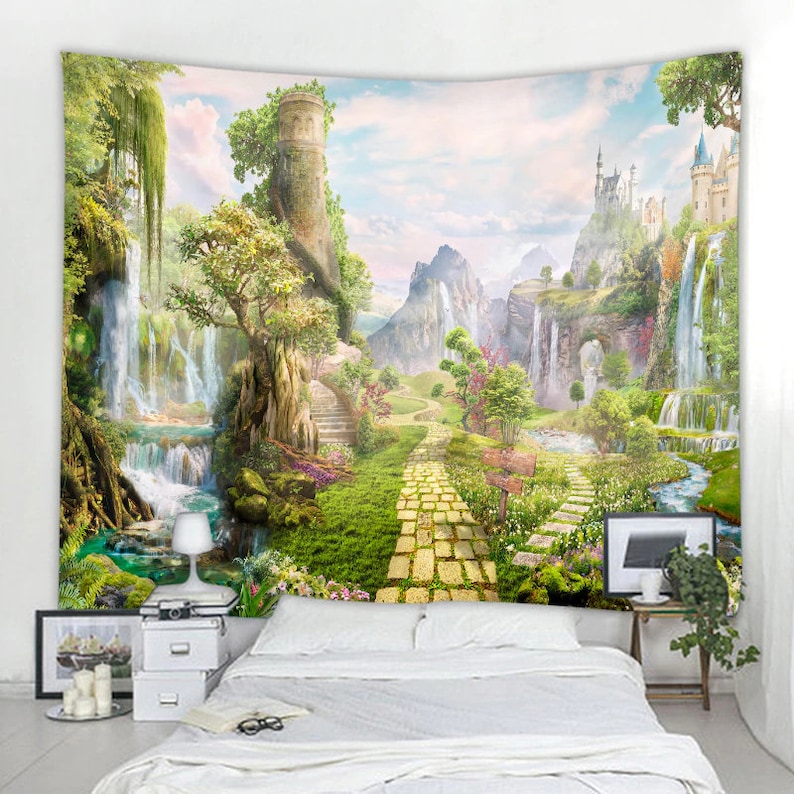 May include: A tapestry featuring a whimsical landscape with a yellow brick road leading to a castle in the distance. Lush greenery, waterfalls, and a stone tower are depicted in the scene.